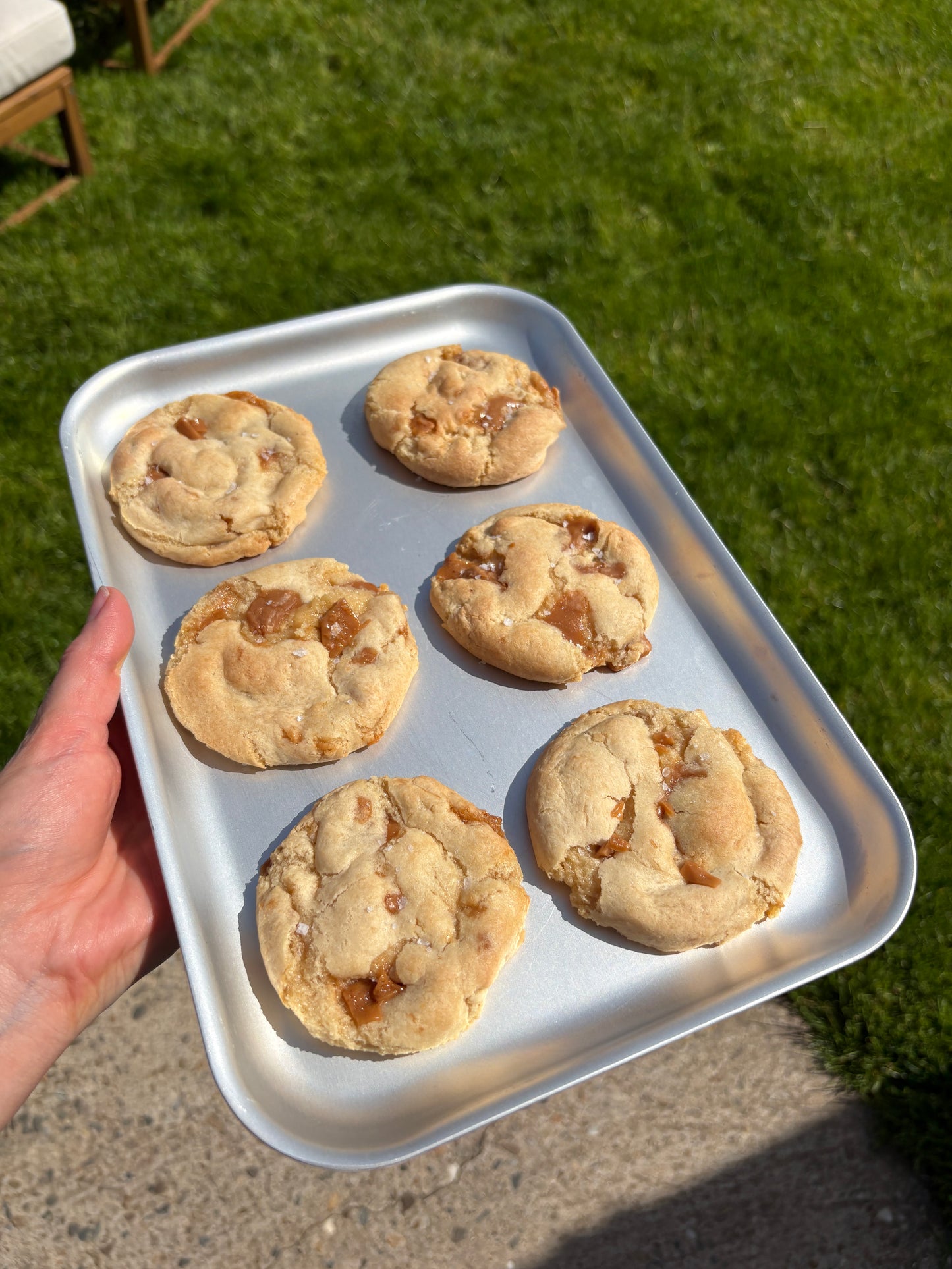 A Tray of 6 Gluten Free Salted Caramel Cookies being held